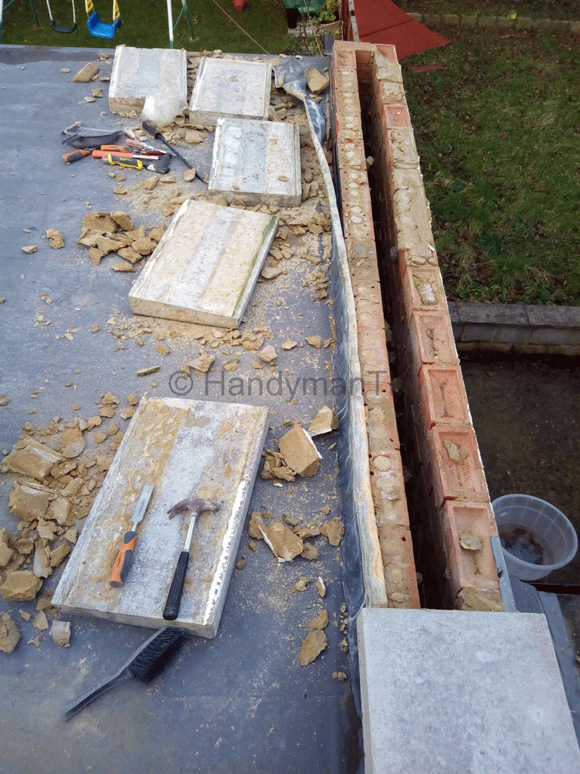 Handyman TK removing slabs on flat roof to repair leak
