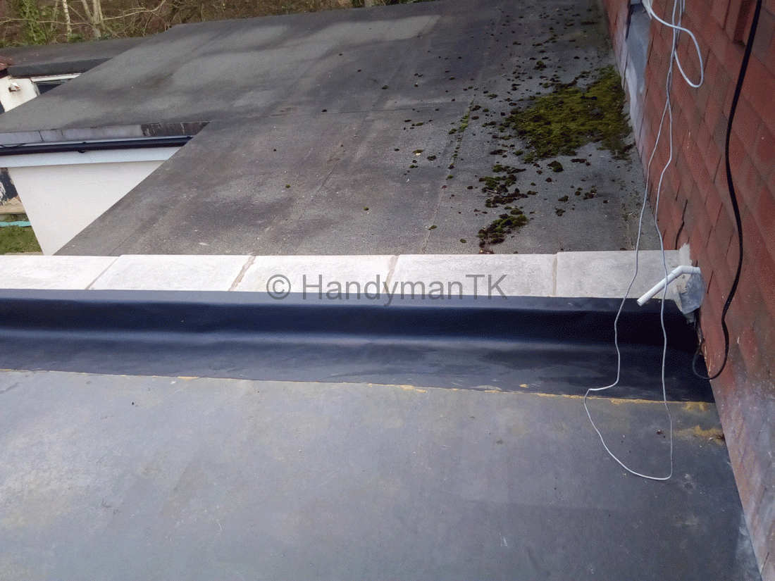 Handyman TK replacing slabs after fixing leak on flat roof